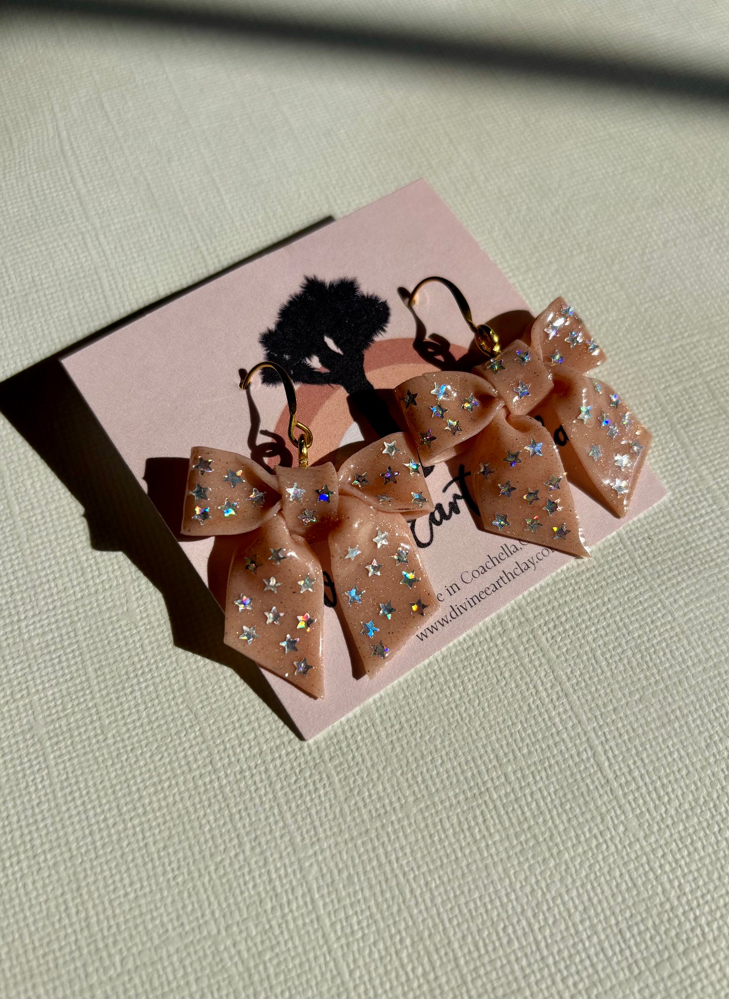 Cute handmade bows made of polymer clay and sealed with resin.